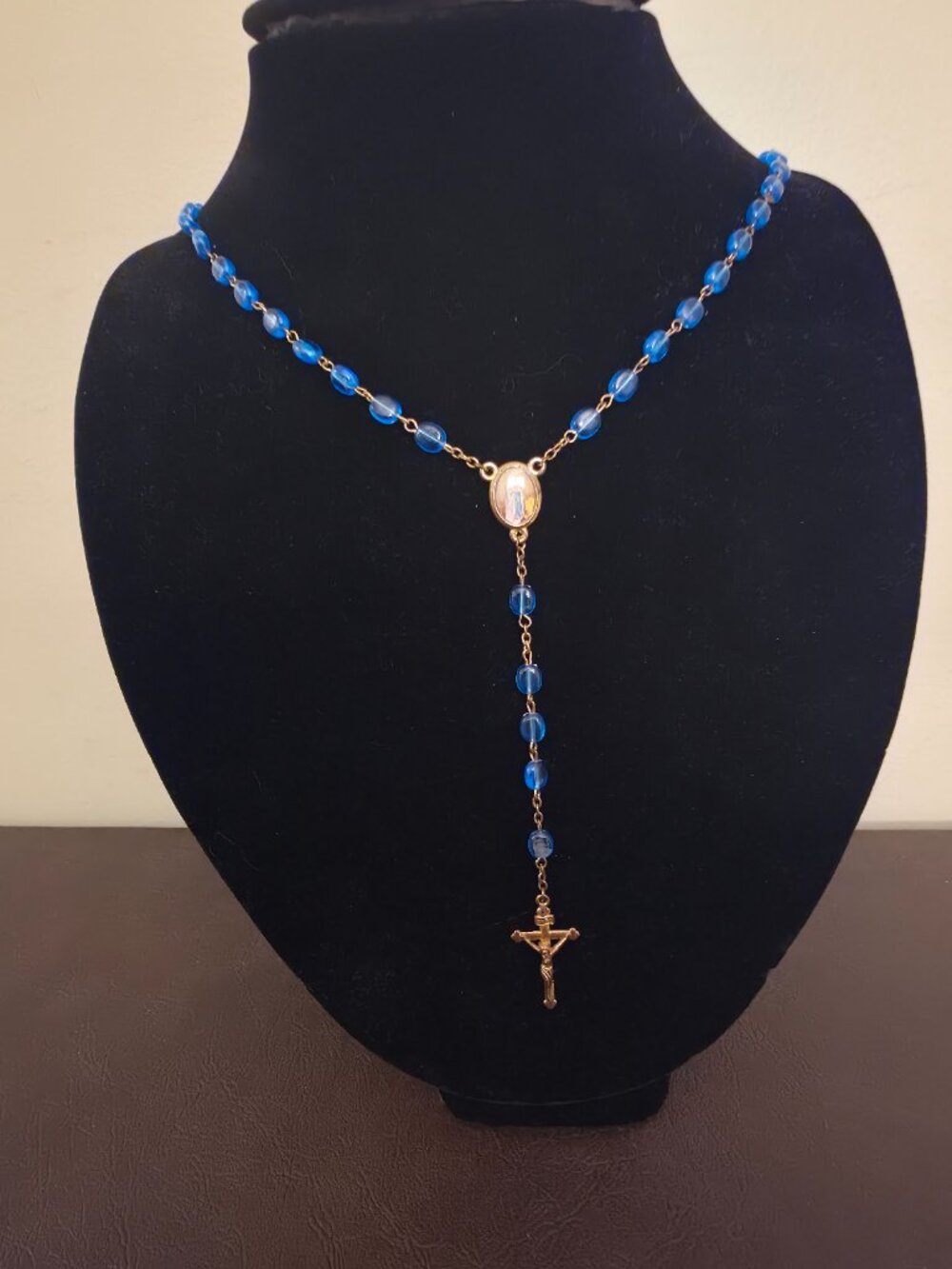Vintage blue glass Catholic rosary beads with a gold tone crucifix Jesus